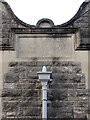 Memorial stone on the hall wall