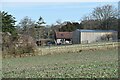 Farm buildings and paddocks at Belmore Cottage