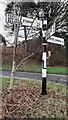 Cumberland County Council finger signpost at cross roads at south end of Faugh