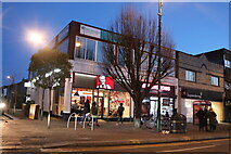 TQ3987 : Shops on High Road, Leytonstone by David Howard