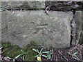 Weathered benchmark on Ashton Road railway bridge