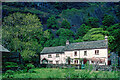 SD3199 : Low Yewdale Farmhouse from Tarn Hows Wood by Julian Paren