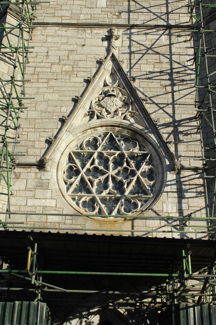 Ornate window above the main entrance door St Margaret's Church, Bodelwyddan