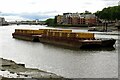 TQ2977 : Containers of refuse on barges on the River Thames by Steve Daniels