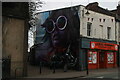 View of a mural on the side of Clemens Mini Market on Clemens Street