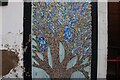 View of a mosaic tile tree on the front of the old Banks