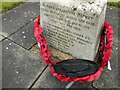 Part of the war memorial in St Giles churchyard in Totternhoe