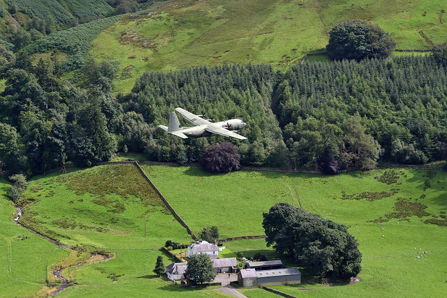 A low flying RAF Hercules over Riskinhope Farm