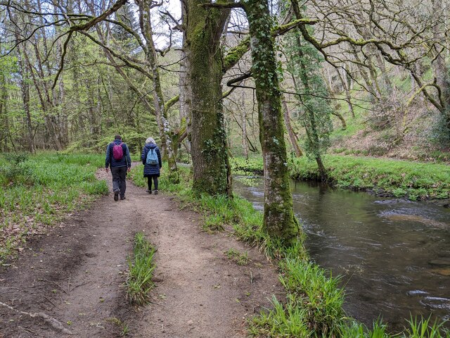 Walkers next to the river, heading west