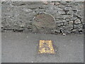 Old Milestone by flats on the High Street, Worle