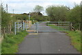 Stile and gate at junction of path and farm road