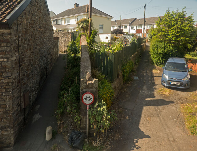 Two footpaths, one leading to Mead Park, the other to Bickington Lodge