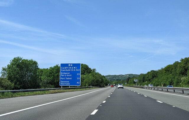 On the M4 heading west, with sign showing distances