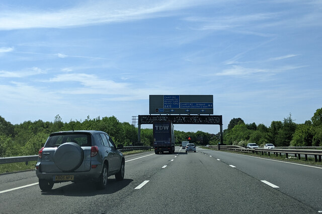 On the M4 heading south-west, overhead gantry with road signs ahead