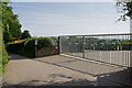 Heavy gates protecting John Deere tractors at Smallridge Bros Ltd