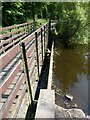 Footbridge and weir on the River Ore