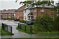 View across footbridge into Barfoot Close