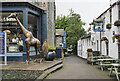 NY2623 : Public paved area with giraffe! by Trevor Littlewood
