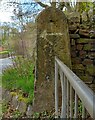 Benchmark cut into gatepost at start of track