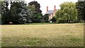 View of #5 Northfield Road across field with horse