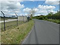 Road by the fence of Deeside Industrial Estate