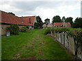 Churchyard and housing, Harrold