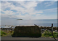 A view over a parapet to the Sound of Pladha from Kildonan, Arran