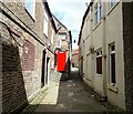 NZ1986 : View down the alleyway by Robert Graham