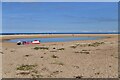 TF8546 : Burnham Overy Staithe: Beach and tidal pool by Michael Garlick