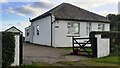 Moss Giel, bungalow on SE side of road east of Great Orton