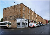 NS5469 : Tenements with shops, Crow Road by Richard Sutcliffe