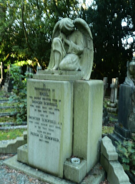 Crouched angel, sleeping, Lawnswood Cemetery