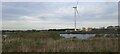 TL2397 : Flooded pits and wind turbine, from the railway by Christopher Hilton