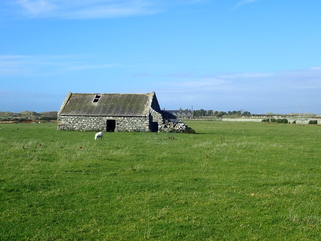 Stone barn in the middle of a field