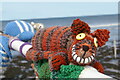 NZ6621 : Alice in Wonderland themed yarnbombing on the pier, Saltburn-by-the-Sea: Cheshire Cat by Christopher Hilton