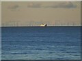 SD3043 : Ship and wind farm in Morecambe Bay by Stephen Craven