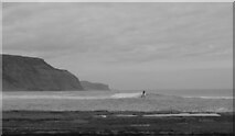 NZ7819 : A surfer seen from Cowbar Steel, Staithes by habiloid