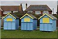 Beach huts and houses on the seafront at Felpham