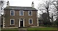 Waver House on south side of A596 east of Waverton