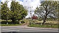 Entrance to farm on north side on A595 opposite Thresher Barn