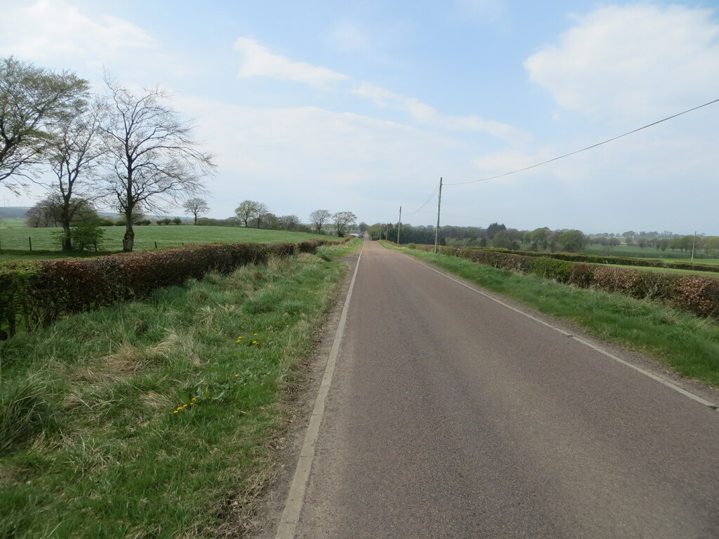 Hedge-lined minor road heading towards... © Peter Wood cc-by-sa/2.0 ...