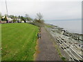 Seating beside the rocky shoreline of the Firth of Clyde at Kirn