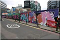 View of street art on a wall on Fairchild Street from Shoreditch High Street