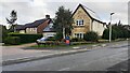 Houses on east side of Ellermire Drive at junction with Strawberry How Road