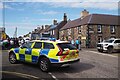 Police Car follows after Tour of Britain in Gordon