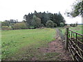 Field path and footbridge crossing Kirtle Water