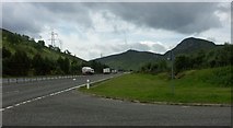 NN6892 : Old A9 rejoins the A9 North of Crubenmore by J M Briscoe