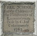 Plaque on the old British School in Llanferres