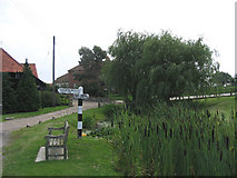 TL5001 : Pond and fingerpost, Woodhatch, Epping, Essex by John Winfield