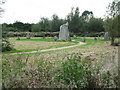 Stone circle on Mallards Way at entrance to estate from London Road